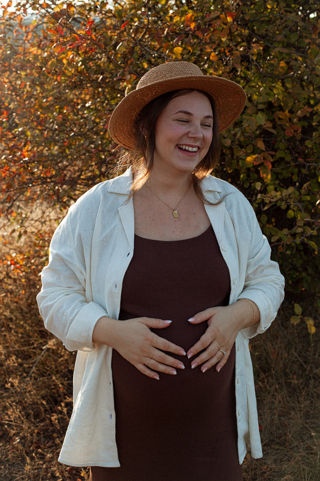 Woman in linen standing in golden autumn light